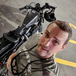 Thad taking a selfie above Miss Scully in a parking garage