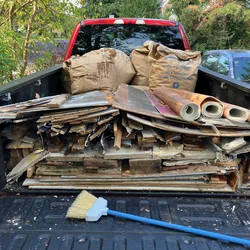 Truck bed loaded with demolition debris from a foyer remodel