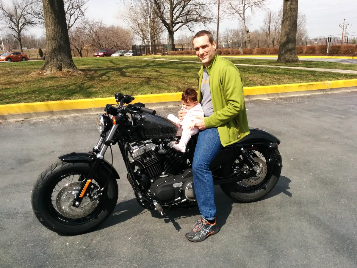 Thad holding baby Leezah on Miss Scully for her first motorcycle ride