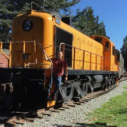 Thad standing on the RSD-4 locomotive at the Northwest Railway Museum