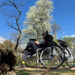 Thad sketching outdoors at Bladensburg Waterfront Park, bike leaned against the bench.