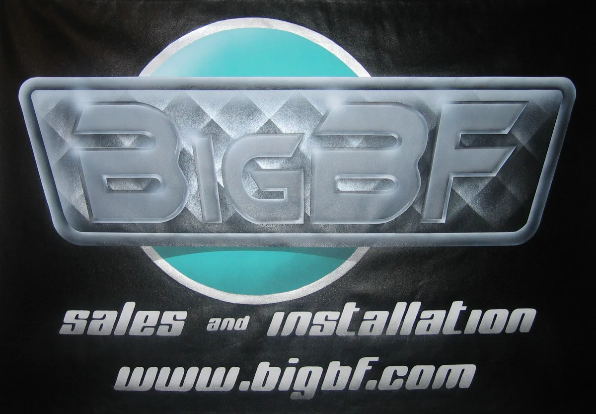 Airbrushed BigBF sign with silver lettering and a teal circle on black canvas