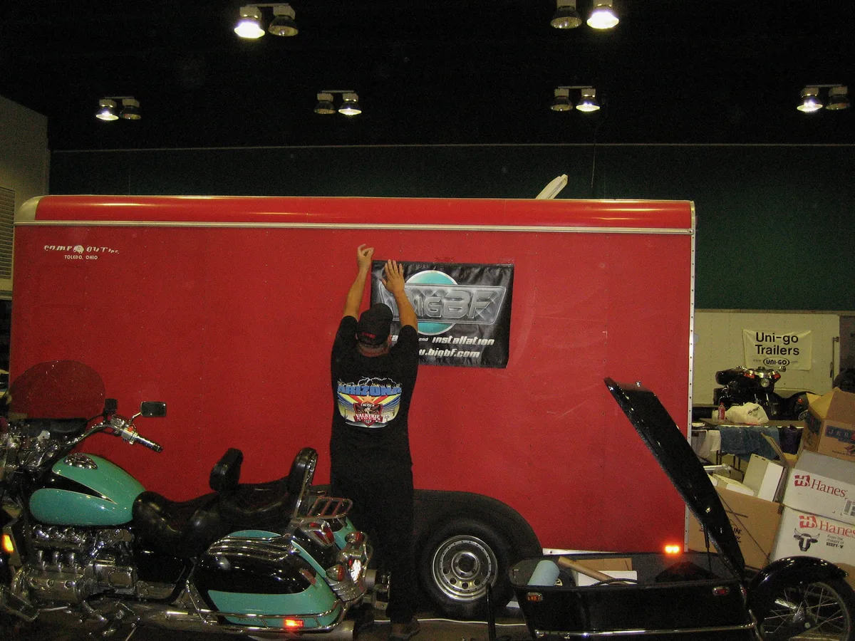 Taping the BigBF sign to a stranger's trailer at the rally