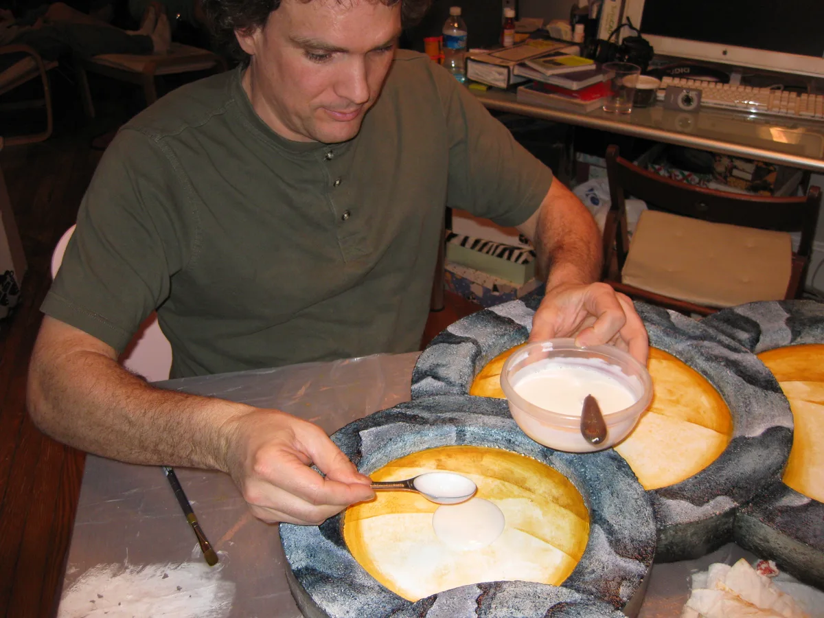 Thad adding a puddle of white medium onto one of the gold circles for Dried Up.