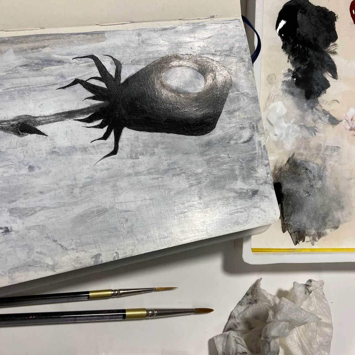 Sketchbook value study of the dried flower form in black, white, and metallic tones, no color.
