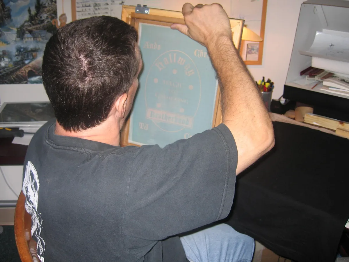 Thad checking the screen and design before printing
