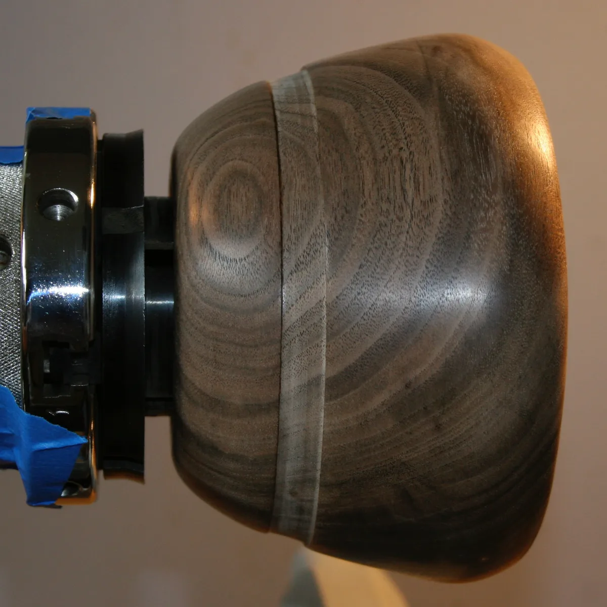 Claro walnut bowl blank mounted on the lathe