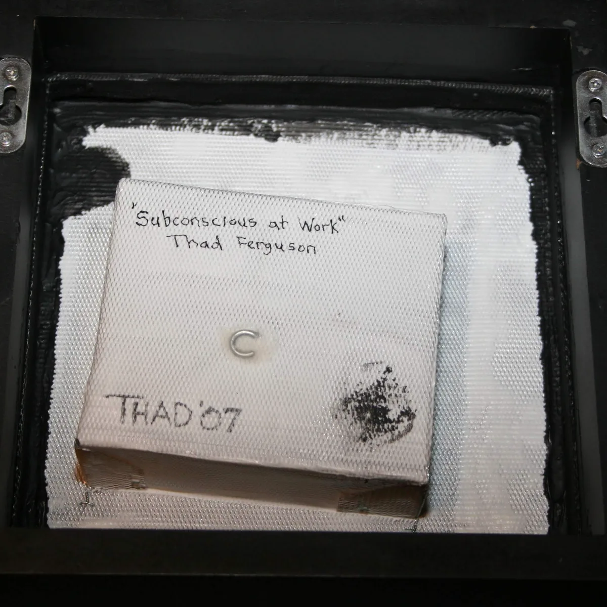 The reverse side of Subconscious at Work, hand-labeled with the title and artist name.